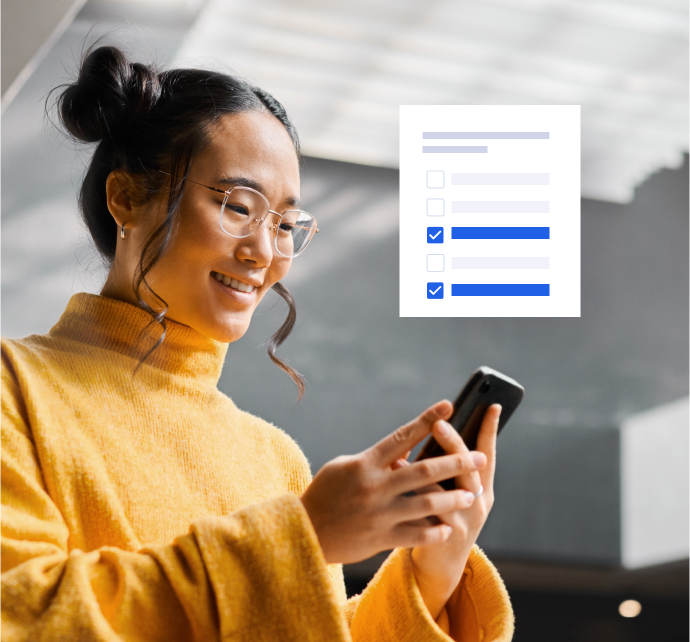 Happy woman checking phone